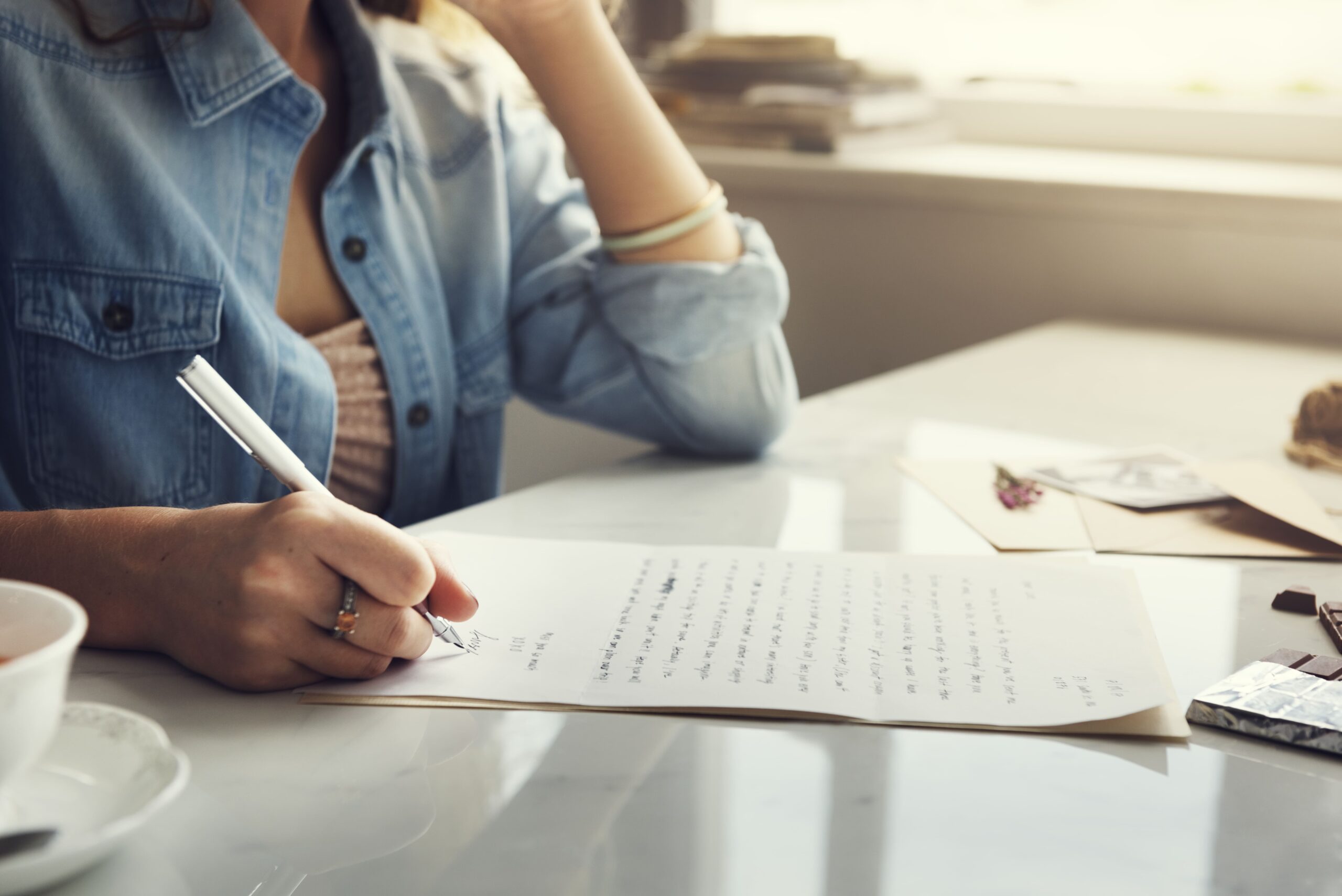 caucasian-woman-writing-letter (1)